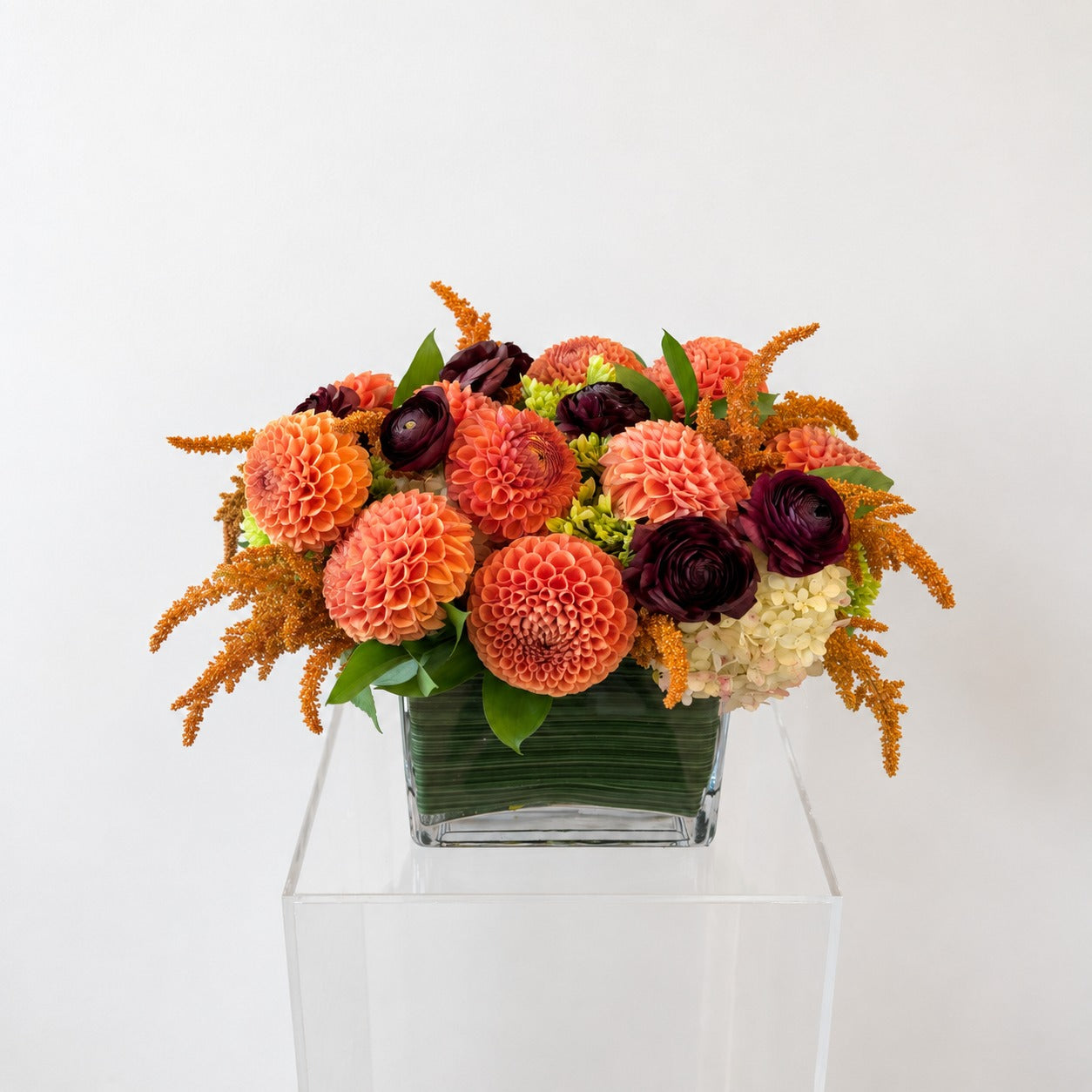 Ember autumn vase arrangement in a leaf-lined glass vessel by BerryBlush Toronto